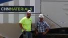 Seth Martin (L), operations manager of materials, and Matt Eshelman, vice president of CH+N Site Construction, stand by their new machine. 