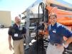 Marty Wolske (L), director of business development, and Tom Krick, regional sales manager of High-Way Equipment Company, Cedar Rapids, Iowa, in front of a XZALT Precision sand and salt applicator system. 