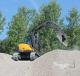 The Mecalac is a versatile machine, combining a skid steer loader with the reach of an excavator.  
