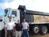 (L-R): Phil Schneider, sales representative, T.J. Novak, store manager, and Randy Sutton, sales, all of RDO Truck Centers, Lincoln, Neb., showcase the 2017 Mack demo truck on site.
