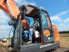 Tom Borchers, assistant foreman of Madison County, Neb., tests this Doosan DX 235LCR excavator from Omaha Tractor & Equipment, Omaha, Neb.
