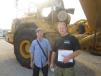 Stanley (L) and Dominic Baran, both of MDB Mechanical, stand in front of this Volvo articulated truck. 