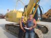 Susan and Kevin Shaw, owners of Shaw Construction, consider bidding on this John Deere 160C excavator. 