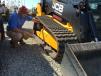 David Eastman, GLM Company in Travelers Rest, S.C., looks at JCB compact track loaders, grinders and  a dump truck during the sale. 
