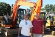 Jim Violett (L), owner of JV’s Home Improvement, Elizabeth, Conn., and his father-in-law, Ronald DeCosta, were checking out the Hitachi Zaxis 75 mini-excavator. 