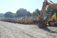Backhoe loaders were lined up and ready to go. 