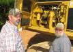 Tim Thompson (L) and John Short, both of Thompson Grading & Clearing, Bowden, Ga., begin their inspection of this Cat 345 BL excavator. 