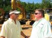 Tony Patterson (L) of Joey Martin Auctioneers and Brent Beverly of BTM Machinery, Charleston, S.C., discuss some of the machines about to go on the auction block. 