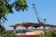 Honolulu Transit photo. Using a crane on top of the guideway for segment erection helps to minimize traffic impacts along Fort Weaver Road. 