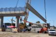 Construction crews placed the first of 42 massive steel and concrete girders on the new Tuolumne Street Bridge in downtown Fresno. 
 