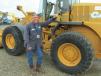 Neil Martin of TEC Well Service in Longview, Texas, gives this 521D Case loader a thorough once-over before bidding on it. 
 