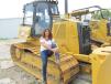 Penny Towner of Lazy River Ranch in Livingston, Texas, looks at this Cat D6K  
