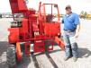 Bubba Paschal of P&P Trailer Sales in Pasadena, Texas, looks over this Manitou cargo mover. 
 