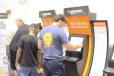 The self-serve customer kiosks were kept busy during the auction. 
