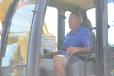 Danny McHenry, owner of Danny McHenry Backhoe & Paving Inc., Worton, Md., tests the controls. 