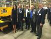 (L-R): Gov. Nikki Haley and Glen, Wayne, Cameron and David Calder stand in front of a Mauldin 1750C that is on the assembly line. 