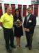 John Craig (L), master welder of Calder Brothers, and David Calder present Gov. Nikki Haley with this one of kind steel welded sculpture of a Yellow Jessamine, South Carolina’s state made by Craig on behalf of Calder Brothers. 