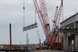 Twin Manitowoc 2250s erected girders from trestle.
 