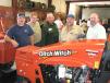 (L-R): Tory Wilson and David O’Neal of Flint Energies, Reynolds, Ga.; Danny Wingard and Wendell Nealey of Sumpter EMC, Americus, Ga.; and Todd Human, Ditch Witch of Georgia, look over RT45 trenchers on display in the shop area.