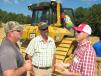(L-R): Jeff Flake and Cory Mason, both of Elm Services, Helena, Ala., and Grady Burchfield, Thompson Tractor, discuss their experience with grade control machines. 