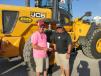 Dale (L) and Jeremy Wilkins of Wilkins Lawn and Landscape in Ardmore, Okla., would like to take this JCB 456 loader back to Oklahoma with them. 
 