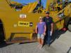 Brenda (L) and Jeff Wetzel of Big Iron Heavy Equipment Construction in Blanket, Texas, are very interested in this Cat 621H scraper. 
 