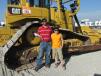 Albert Headings (L) and his son, Kayden, an independent contractor in Rose, Okla., think this Cat D6 dozer will be perfect for his next job. 
 