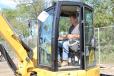 Jim Bodkin, owner of Bodkin Excavating, Bellport, N.Y., tries out the controls. 