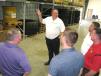 Winslow Robin Williams, Hydrema U.S. warehouse manager, leads a group on a tour of the new facility. 