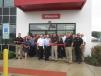 Garrett Patten, president of Patten CAT, cuts the ribbon to officially open the new Wauconda, Ill., store.
