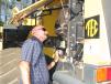 Tim Thomas of Tractor & Equipment Co., Birmingham, Ala., looks at the engine of a Komatsu WA380 wheel loader. 
 