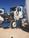 Steve Murphy of Bonham, Texas, inspects one of the many truck tractors sold in the Stanton, Texas, auction.
 