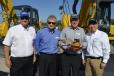 Kobelco presents Jerry Tracey with a hand-crafted wooden model of a Kobelco excavator to commemorate Tracey Road Equipment’s 40th anniversary and long history with Kobelco. (L-R): Terry Ober of Kobelco; Randy Hall of Kobelco; Jerry Tracey of Tracey Road Equipment; and Pete Morita, president and CEO of Kobelco.