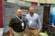 Rick Person (L) and Scott Smith, both territory managers of IronPlanet, are ready to discuss upcoming online auctions with UTCA convention guests. 