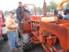 Brothers Joe (L) and Louis Vaz, owners of Vaz Quality Works of Bridgeport, Conn., inspect a Ditch Witch on the grounds.
 