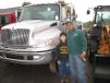 Alex Alvarez, owner of AA Industries of South Windsor, Conn., brought his son Anthony Alvarez to the auction. Alvarez was interested in the service truck behind them.
 