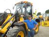 Jeremy Seavers mans the Fairchild Equipment Co. display area and stands in front of this JCB 411 HT wheel loader. 