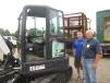 Jim Radart (L) and Paul Cappelle, both of Bobcat Plus, check out this Bobcat E55 mini-excavator.
 