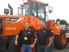 Jim Barry (L) and Ron Ison, Swiderski Equipment Co., display this Doosan DL220 series 5 high lift loader at the expo. 
 