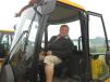 Andrew Mosier, Mosier Excavating, looks over the cab of this JCB 407 compact wheel loader.
