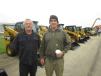 Jack Maloney, Merc Group LLC, and John O’Neill, owner O’Neill Excavating, shop the selection of Cat machines. 

