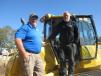 Tom Elam (L), Roland Machinery Co., speaks with Doug Huser of Huser Landscaping about the Komatsu  D61 Pxi dozer equipped with Intelligent Machine Control.
 