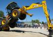 Tom Frazier, backhoe-loader product specialist of JCB, based in Savannah, Ga., puts on a show for the crowd using this JCB 4CX backhoe.