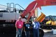 (L-R): TJ Sparks, Vanity Rojas and Vernon Bruton of Cisco Equipment are eager to talk about Link-Belt’s 300x4 excavator.
 