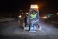The MC115C skid steer loader powers through the night, working quickly and efficiently.
