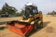 This Cat 246C skid steer stands ready to demonstrate the abilities of the ALLU DL screening bucket. 