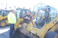 David Oliphant (L), owner of Mow Blow & Go Outdoor Services in Perry Hall, Md., purchased a skid steer from Chris Redding of Alban CAT.