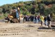 Attendees line up to operate this Cat 323F excavator equipped with Trimble technology.
