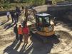 Guests receive instruction while operating this Cat 305E mini-excavator.