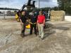 (L-R): Youssef Benjemaa and Randy Tinley, both of JCB, give operating tips to John Marc Hall of Lide Plumbing in Newberry, S.C. 
